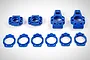 A set of blue plastic RC rear hub components and circular shims arranged on a white background.