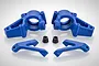 A set of blue nylon front steering hubs and associated suspension parts for an RC vehicle, arranged on a white background.
