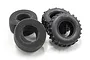 Two black rubber RC buggy rear tyres with tread patterns and two matching black foam tyre inserts on a white background.