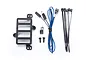 Traxxas TRX-4 Ford Bronco reverse light kit components including a black plastic bracket, LED light harness, zip ties, and mounting screws.