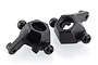 Two black plastic front hub carriers for UDI RC vehicles, shown from a top-down angle against a white background.