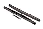 Two grey anodized aluminium rear trailing arms for a Traxxas RC vehicle, shown with a set of small hollow balls.