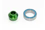 A green anodized aluminium bearing adapter and a metal ball bearing with blue rubber seals on a white background.