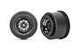 Two Traxxas Weld black chrome rear drag racing rims for RC cars, shown from front and side angles against a white background.
