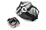 A black Dusty Motors protective mesh cover for RC cars alongside a roll of adhesive Velcro tape on a white background.
