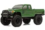 Axial SCX10 III Base Camp RC rock crawler in green with black off-road tires and wheels, shown from a front-quarter angle on a white background.