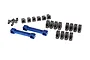 A set of blue anodized aluminum suspension mounts and various grey plastic suspension arm components for a Traxxas 4-Tec RC car.