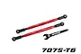 Two red anodized aluminium Traxxas toe links with black rod ends and a matching black 10mm wrench on a white background.