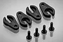 Four black plastic LED light clips and four matching black screws arranged on a light grey surface.