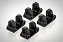 Four black aluminium RC linkage mounts arranged on a white background.