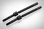 Two black steel CVD driveshafts for RC cars, shown at an angle against a light grey background.