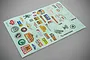 A sheet of various RGT and off-road themed stickers for RC vehicles, featuring logos, text, and graphics on a light blue backing.