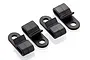 Four black plastic wire clips for RC cars arranged in a row on a white background.