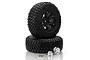 Two black RC crawler tires mounted on black beadlock rims, with two silver wheel hubs and small screws placed in front on a white background.