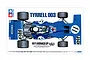 Top-down view of the Tamiya 1/12 Tyrrell 003 1971 Monaco GP model kit box art featuring the blue Formula 1 car with driver figure.