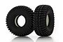 Two black rubber RC off-road tires with aggressive tread patterns and white foam inserts, standing upright on a white background.