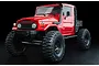 A red MST CFX-W J45C 1/10 scale RC rock crawler truck featuring a detailed body, snorkel, and large off-road tires against a black background.