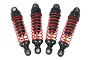 A set of four LaTrax RC shock absorbers featuring red coil springs, black plastic caps, and gold-coloured shafts against a white background.