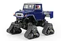 A Tamiya GF-01FT Toyota 40 Series Land Cruiser RC truck kit with blue body and black tank tracks on a white background.