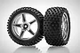 Two HSP 1/10 scale RC buggy rear wheels with black rubber knobby tires mounted on five-spoke silver chrome plastic rims.