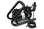 Iwata Power Jet Plus airbrush compressor with a black handle, pressure gauge, and braided air hose on a white background.
