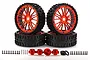 A set of four Rovan 6.5 inch all-terrain RC wheels with black knobby tires and metallic red multi-spoke rims, including hex adapters and mounting hardware.