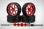 A set of four Rovan 6-inch all-terrain RC wheels with black rubber tires and metallic red rims, including hex adapters, pins, and mounting hardware.