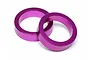 Two purple anodized aluminum circular spacers for HPI Baja RC cars on a white background.