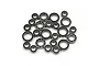 A collection of various sized metal ball bearings with black rubber seals arranged on a white background.