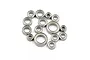 A collection of 15 various sized steel ball bearings for RC vehicles arranged on a white background.