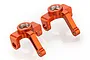 Two orange anodized aluminium steering hubs for HSP RC cars, shown from an elevated angle against a white background.