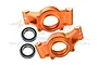 Two orange anodized aluminium RC rear hubs with GPM branding and two metal ball bearings on a white background.