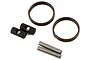 Traxxas Sledge constant-velocity driveshaft rebuild kit components including two metal rings, two cylindrical pins, and two black barrel-shaped parts.