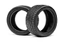 Two black HPI Racing wide radial RC touring car tires standing upright on a white background.