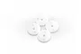 Four white circular shock pistons with two holes each, arranged in a cluster on a white background.