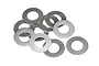 A pile of ten small, thin, circular metal washers on a plain white background.