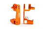 Two orange anodized aluminium C-hub carriers for Traxxas RC vehicles, showing the TRX logo and R marking on a white background.