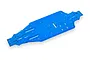 A bright blue anodized aluminium main chassis plate for a Traxxas RC vehicle, shown from an elevated angle against a white background.