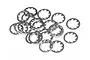 A pile of small, silver-coloured internal tooth locking washers scattered on a white background.