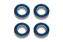 Four Factory Team rubber shielded ball bearings arranged in a square grid against a white background.