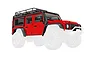 A red Traxxas 1/18 scale Land Rover Defender body shell with black roof rack, snorkel, and fender flares, shown against a white background.