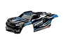 Traxxas 1/8 Sledge RC truck body shell, pre-painted in black with blue and white graphic accents.