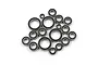 A collection of various sized metal ball bearings with black rubber seals arranged on a white background.