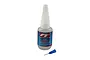 A bottle of Factory Team tire adhesive with a separate blue applicator needle tip on a white background.