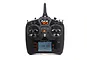 Spektrum NX10 10-channel 2.4GHz RC transmitter in black with a digital screen displaying P-51 Mustang model settings.
