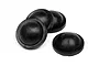 Four black rubber shock diaphragms for RC cars arranged on a white background.