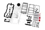 Traxxas 1/18 Land Rover Defender unpainted body shell kit with various black plastic accessories, roof rack, and decal sheet on a white background.