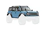 Traxxas 1/18 scale Ford Bronco Area 51 blue body shell with black roof and accessories, shown against a white background.