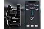 SkyRC Digital Camber Gauge for 1/10 touring cars next to a smartphone displaying the companion app interface showing a 0 degree reading.