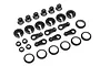 A set of black plastic RC shock absorber parts including shock ends, spring retainers, and spacers on a white background.